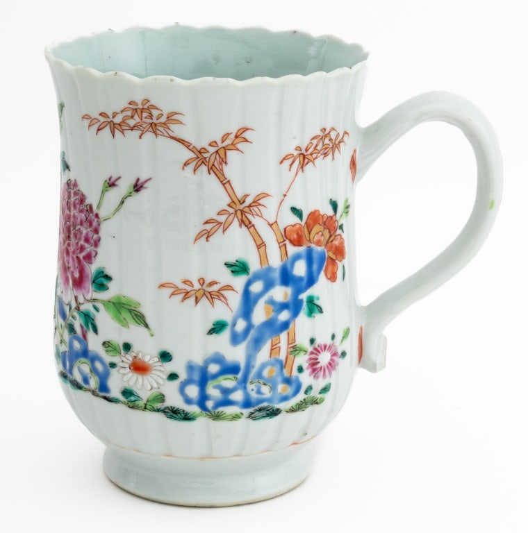 Chinese Export Famille Rose Porcelain Mug, c. 1760: Chinese Export Famille Rose Porcelain Mug, Qianlong Period, circa 1760, fluted with hand-painted floral motif and scalloped rim. 6.25" H x 7.25" W x 4.5" D. Provenance: Lynda Willauer Antiques, Nantuc