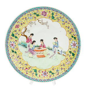 Chinese Famille Rose Porcelain Charger: Chinese Famille Rose Yellow Ground Porcelain Charger, hand-painted with central medallion depicting four women playing a game in a landscape scene, red four character Qianlong seal mark to underside.