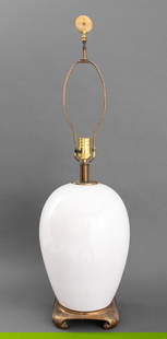 Chinese Porcelain Vase Mounted as a Table Lamp: Chinese White Glazed Porcelain Vase Mounted as a Table Lamp, atop a gilt metal scrolled base and surmounted by a carved greenstone bi disc finial. 34.75" H x 9.5" Diameter. Provenance: From the Upper