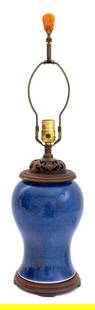 Chinese Powder Blue Glazed Vase Mounted Lamp: Chinese Powder Blue Glazed Baluster Vase Mounted as a Table Lamp, with reticulated carved hongmu cover and Buddha hand form carved red agate finial, atop a wooden base. Overall: 26.25" H x 6.5" Diamet