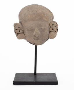Veracruz Pre-Columbian Pottery Head Sculpture: Veracruz Pre-Columbian Pottery Head Sculpture, the fragment wearing a headdress, together with ebonized metal stand. Overall: 5" H x 3" W x 2" D; head: 1.75" H x 3.25" W x 3"D. Provenance: From the Up