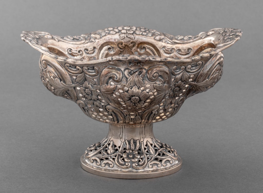 Charles Harris Sterling Silver Basket, 19th C.: Victorian Sterling Silver Pierced Basket, marks for London, Charles Stuart Harris, 1888, with floral and scroll repousse design on circular base. Weight: 8.22 ozt.; 4.5" H x 7.25" W x 6" D. Keywords: