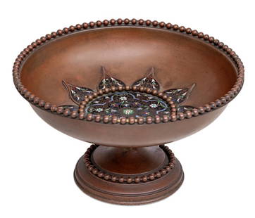 French Patinated Metal and Enamel Bowl: French Patinated Metal and Champleve Enamel Bowl, late 19th century, the bowl with beaded edge, centered by an enamel floral design, on a conforming base. 6.5" H x 11" Diameter. Keywords: Tableware,