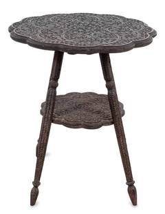 Indian Carved Hardwood Two-Tier Table: Indian Carved Hardwood Two-Tier Table, early 20th century, possibly Kashmiri, the circular lobed top elaborately carved with foliate scrolled designs, on four splayed tapering legs, conjoined by