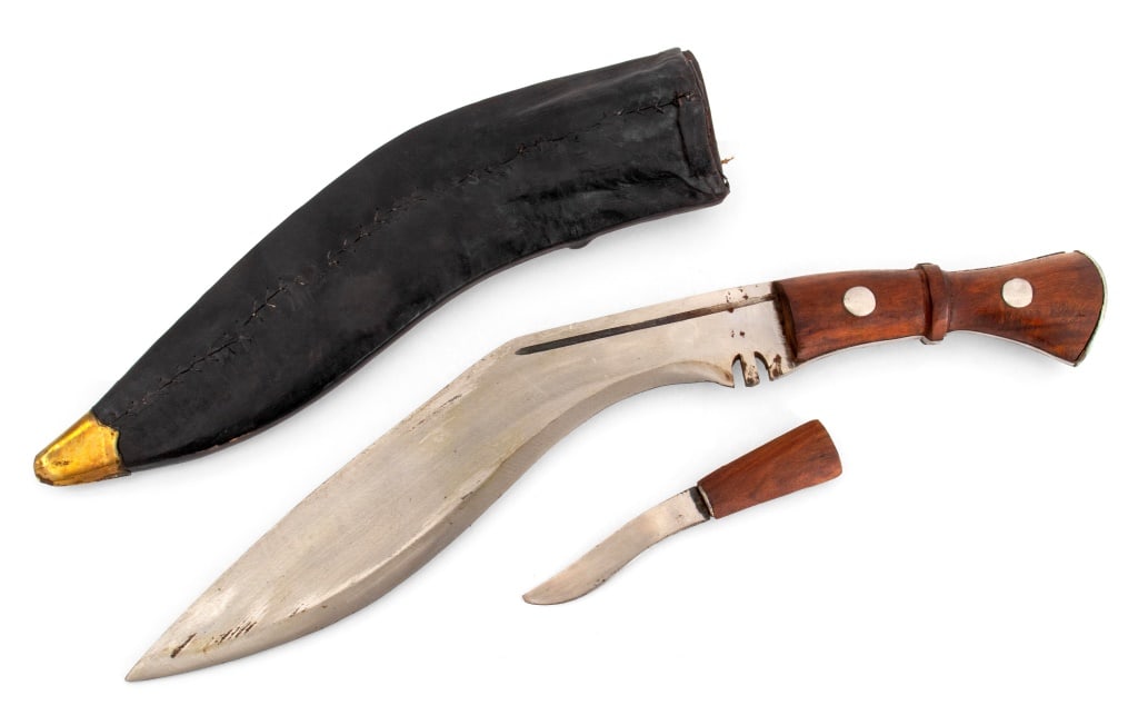 Nepalese Gurkha Kukri Machete & Knife: Nepalese Gurkha Kukri Machete and Knife, with Leather Sheath, circa second half 20th century, broad arrow mark to blade, wooden handles. Sheathed: 18" L x 3.5" W. Provenance: From a New York City Coll