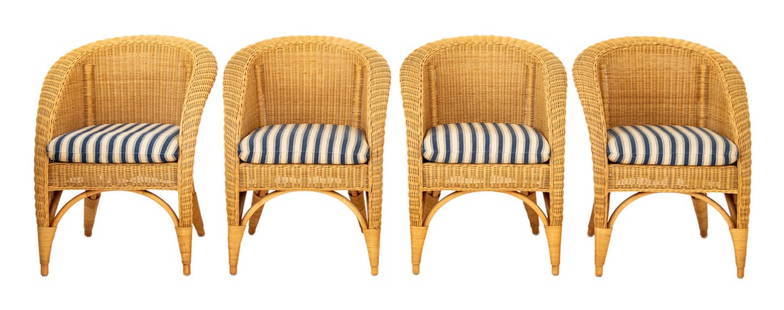 Varaschin Wicker Armchairs, 4: Set of Four Varaschin Woven Wicker Arm Chairs, with blue and beige striped cushions. 31.5" H x 26.25" W x 24" D; seat: 20" H. Provenance: From a Vintage Collection of Italian Designer Furniture Sample