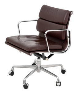 Eames Style Soft Pad Adjustable Office Chair: Eames Style Soft Pad Adjustable Office Chair, with brown leather upholstery and chrome plated frame atop five casters. 31.5" H x 23" W x 27" D; seat: 19" H. Provenance: From a Park Avenue Collection.