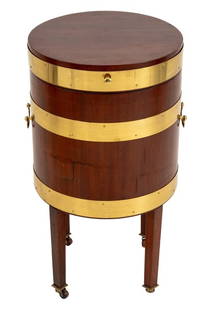 Regency Brass-Bound Mahogany Cellarette: Regency Brass-Bound Mahogany Cellarette, early 19th century, cylindrical with handles and atop four casters. 28.75" H x 17.5" W x 15.5" D. Provenance: From a Palm Beach Collection. Keywords: Antique