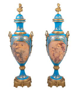 Sevres Bleu Celeste Ground Ovoid Vases, Pair: Pair of Sevres Bleu Celeste Ground Gilt Metal Mounted Porcelain Ovoid Vases, early 20th century, each with a domed cover, surmounted by a portrait bust, mounted with ring handles, the bodies with oval