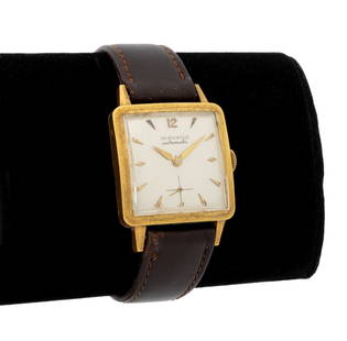 Movado 18K Yellow Gold Automatic Watch: Movado 18K Yellow Gold Automatic Watch, featuring a silvered dial with golden Arabic and dagger hour indices and sub-dial at 6 o'clock, powered by a automatic self winding movement, marked: "Movado Au