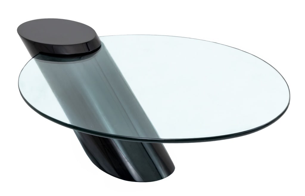 J. Wade Beam for Brueton "Zephyr" Coffee Table: J. Wade Beam for Brueton "Zephyr" Cantilevered Coffee Table, 1980s, slanted black column with an oval glass top cantilevered into a wedge. 17" H x 52" W x 34" D. Provenance: From a New York City Colle