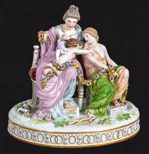 Meissen "Cupid's Wings Clipped" Figural Group: Meissen Porcelain "Cupid's Wings Clipped" Figural Group, late 19th century, on an oval base, marked with blue crossed swords to underside, number 1762. 10.5" H x 11.5" W x 8.75" D. Keywords: Statue, S
