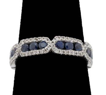 18K White Gold Diamond Sapphire Ring: 18K White Gold Diamond Sapphire Band, featuring 80 bead set round brilliant cut diamonds weighing a total of approx 0.23 carat, further decorated with 12 channel set sapphires weighing a total of