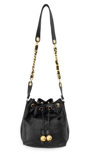 Chanel Black Leather Drawstring Bucket Bag: Chanel Black Leather Drawstring Bucket Bag, with stitched "CC" logo to the front and gold-tone ball-form tassels and gold-tone chain wrapped black leather shoulder strap, marked "Chanel" to the interi
