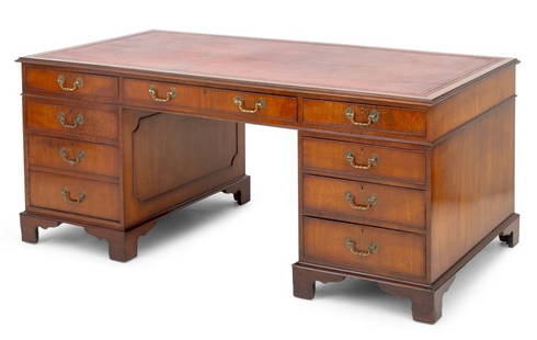 George II Style Leather Top Walnut Desk: George II Style Leather Top Walnut Desk, 20th century, with red leather inset writing surface, three frieze drawers above two pedestals each with three graduated drawers on four bracket feet. 30" H x
