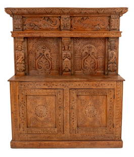 Tudor Style Carved Oak Sideboard: Tudor Style Carved Oak Sideboard, with two doors, each opening to reveal two shelves, the upper portion decorated with caryatids. 73" H x 53.5" W x 15.5" D. Provenance: From an Upper East Side Collect