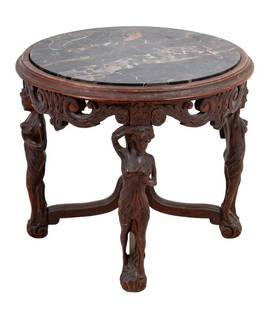 Renaissance Revival Walnut and Marble Low Table: Renaissance Revival Carved Walnut and Portoro Marble Top Circular Low Table, early 20th century, the inset marble top above four caryatid supports joined by a stretcher. 21" H x 24" Diameter. Keywords