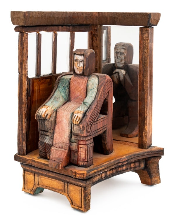 Folk Art Carved Wood Enthroned Figure: Folk Art Carved Wood Enthroned Figure, with reverse carved kneeling figure, signed "Suder" to underside, mounted on mirrored stand with four glass windows. Overall: 15" H x 6.25" W x 7.5" D. Provenanc