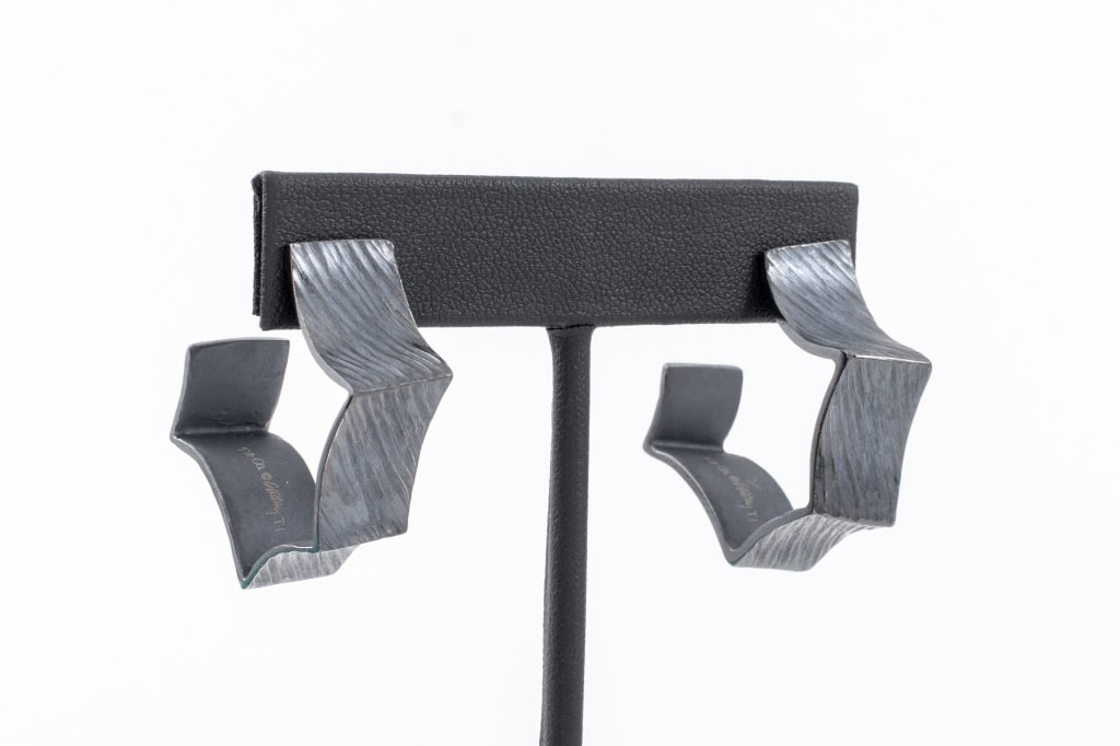 Frank Gehry for Tiffany & Co. Titanium Earrings: Frank Owen Gehry (Canadian/American, b. 1929) for Tiffany and Company Pair of Blackened Titanium Earrings, of hexagonal forms with textured surfaces, each marked "T & Co. (c) Gehry T1" inside, togethe