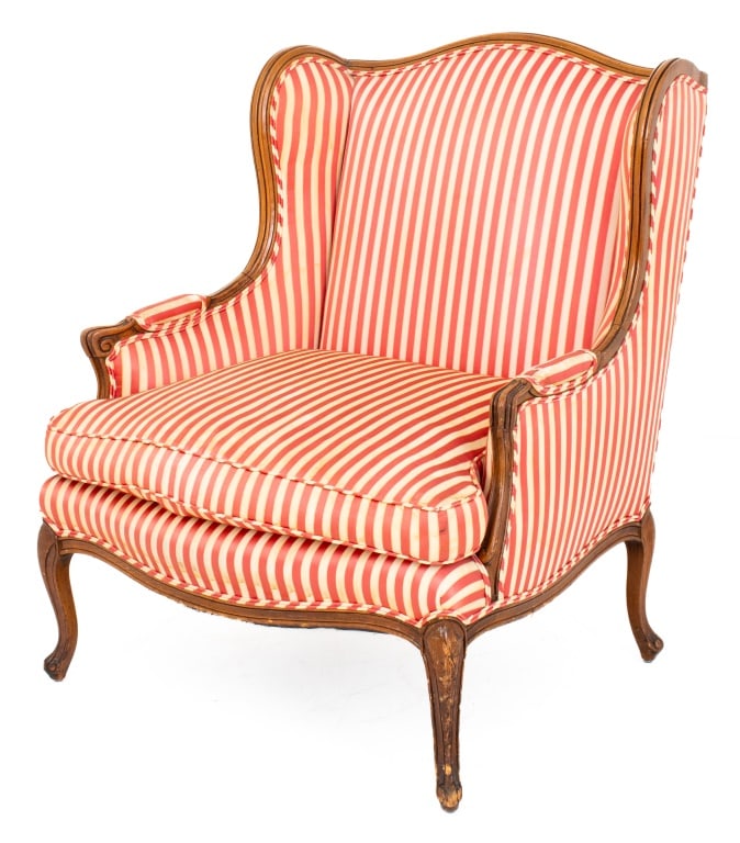 Louis XV Style Upholstered Wood Bergere: Louis XV Style Upholstered Wood Bergere, overall upholstered in a red and white awning stripe fabric, the molded frame above four cabriole legs. 38" H x 30" W x 30" D; seat: 18" H. Provenance: From a