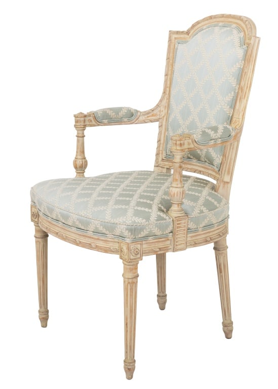 Louis XVI Style Painted Fauteuil: Louis XVI Style White Painted Fauteuil, with light green cotton upholstery on four fluted legs. 38.5" H x 24.75" W x 22" D; seat: 19" H; arms: 26.5" H. Provenance: From a Fifth Avenue Collection. Keyw
