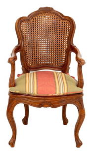 Louis XV Style Walnut Child's Fauteuil: Louis XV Style Walnut Child's Fauteuil, with caned back and striped upholstered seat cushion, on cabriole legs, stamped " Made in Italy" to the underside. 30" H x 18" W x 16" D; seat: 15.75" H. Proven