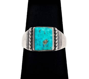 Navajo Dine Silver Turquoise Ring: Navajo Dine Silver Turquoise Ring, with one bezel-set 10 x 8 mm rectangular cabochon-cut turquoise. Ring: 0.875"L x 0.375"W. Ring size: 6. Silver tested. Approx: 0.11 ozt. inclusive. Provenance: Prope