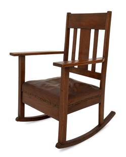 Arts and Crafts Oak Wood Rocking Chair: Arts and Crafts Oak Wood Rocking Chair, early 20th century, with leather covered and riveted seat. 36" H x 25.75" W x 26.75" D; seat: 14.25" H. Provenance: From a Private New York City Collection. Key