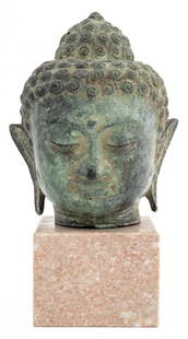 Southeast Asian Patinated Bronze Buddha Head: Southeast Asian Verdigris Patinated Bronze Buddha Head, together with hardstone plinth. Overall: 10.5" H x 5.75" W x 5.5" D. Provenance: From a West 12th Street Estate. Keywords: Asian Arts, SEA, Scul