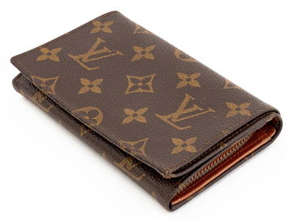 Louis Vuitton Monogrammed Leather Wallet: Louis Vuitton Monogrammed Leather Wallet, snap closure, embossed mark "LOUIS VUITTON / PARIS / made in france" to upper left interior corner, with zippered coin compartment. 3.5" H x 5.5" W x 1.25" D.