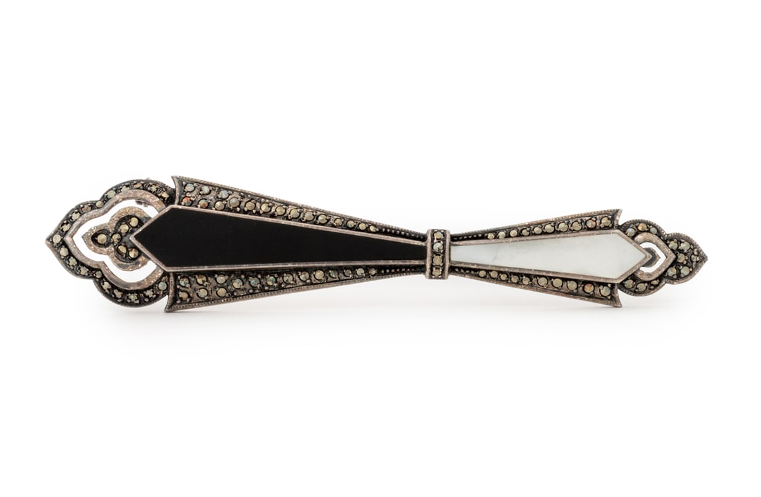 Mother-of-Pearl & Obsidian Sterling Silver Pin: Mother-of-Pearl and Obsidian Sterling Silver Pin, marked "925". Silver not weighable. 4.25" L x 0.75" W. Provenance: From a new York City Collection. Keywords: Jewelry, Fashion, Accessories, Brooch, A