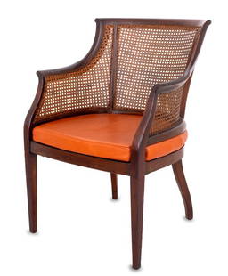 Regency Style Barrel Back Caned Mahogany Armchair: Regency Style Barrel Back Cane Paneled Mahogany Armchair, with leather covered cushion on four tapered legs. 33" H x 23.5" W x 20.5" D; seat: 18" H. Provenance: From a Central Park West Estate. Keywor