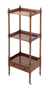 Regency Style Mahogany 3-Tier Whatnot: Regency Style Mahogany Three-Tier Whatnot, with three shelves above a single drawer atop casters. 39" H x 19" W x 14" D. Provenance: The Upper East Side Estate of Anne Kaufman Schneider, the daughter