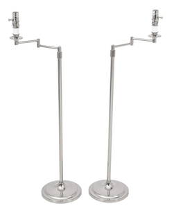 Chrome Swing-Arm Floor Lamps, Pair: Pair of Chrome Swing-Arm Floor Lamps, each with jointed arm atop trumpet base. Fully extended: 45" H x 18.5" W x 10" D. Provenance: From a New York City Collection. Keywords: Lighting, Standing lamp,