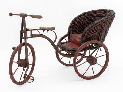 Folk Art Metal Salesman Sample Tricycle, ca. 1900: Folk Art Metal Salesman Sample or Doll Tricycle, circa 1900, with wicker and painted wood seat. 12" H x 21" W x 8.25" D. Provenance: From an East 56th Street Collection / Sutton Place Collection. Keyw