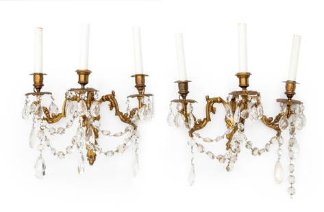 Hollywood Regency Candelabra 3-Arm Sconces, Pair: Pair of Hollywood Regency Candelabra Three-Branch Wall Sconces, brass with glass drops. 14" H x 14" W x 6.25" D. Provenance: From a New York City Collection. Keywords: Lighting, Lamps, Candlestick Sty