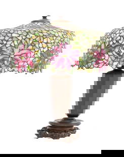 Handel Leaded Glass Table Lamp: Handel Leaded Glass Table Lamp, with green and pink floral design on vasiform patinated bronze base terminating in pierced circular scroll form stand, unmarked. 22.5" H x 18" Diameter. Provenance: Fro