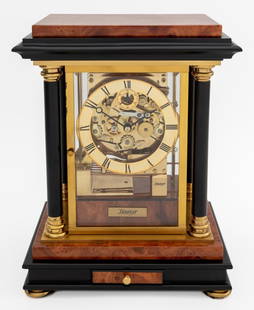 Kieninger Ebonized & Burlwood Table Clock: Kieninger Ebonized and Burlwood Table Clock, with four columns, gilt metal hardware, and door opening to clock face marked "Kieninger" twice to front and "Original Kieninger / Made in Germany / nine (