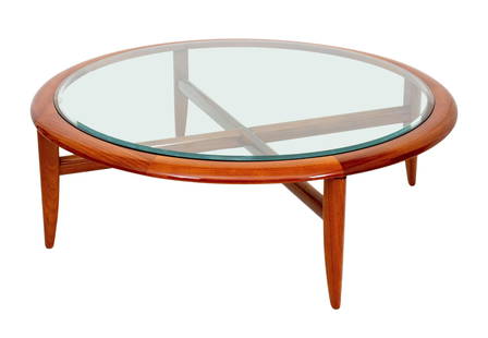 Adam Tihany for Pace Glass Top Mahogany Low Table: Adam Tihany for Pace Collection Glass-Topped Lacquered Mahogany Low Table, Venezia Series, circa 1980, with four legs conjoined by X-form stretcher and beveled glass top. 17.5" H x 51" Diameter. Prove