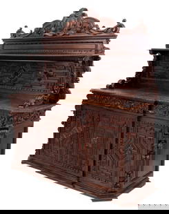 Renaissance Revival Carved Oak Sideboard: Renaissance Revival Carved Oak Sideboard, late 19th century, with a raised paneled back, scrolled supports and display shelf, the breakfront base with leaf carved molded edge above three frieze drawer
