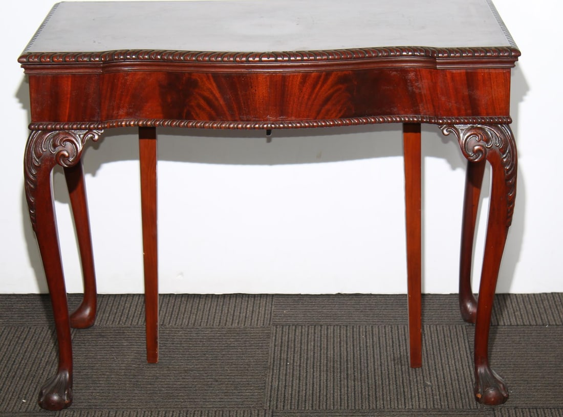 Chippendale Style Flame Mahogany Flip Top Table: Chippendale Style Flame Mahogany Flip-Top Console Table, with three leaves and serpentine top above four acanthus leaf carved cabriole legs on ball and claw feet, along with two swing legs to undersid