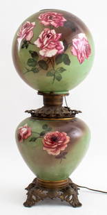 "Gone with the Wind" Painted Double Globe Lamp: "Gone with the Wind" Painted Double Globe Lamp, formerly for kerosene, now electrified, the vessel and globe painted with roses, and with gilt metal base and connector mechanism. 26" H. Provenance: Fr