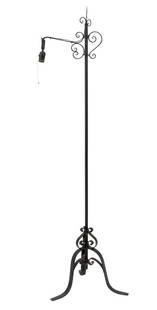 French Style Patinated Wrought Iron Floor Lamp: French Style Patinated Wrought Iron Floor Lamp, with scroll form motif on tripod base. 64.25" H x 21" W x 18" D. Provenance: From a Greenwich, Connecticut Collection. Keywords: Lighting, Standing lamp