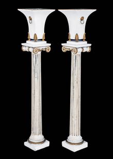 Hollywood Regency Patinated Metal Torchieres, 2: Pair of Hollywood Regency Patinated Metal Torchieres, with lion head ring handles on brass paw feet mounted on mirrored fluted ionic columns terminating in square bases. 51" H x 11.25" W x 11.25" D. P