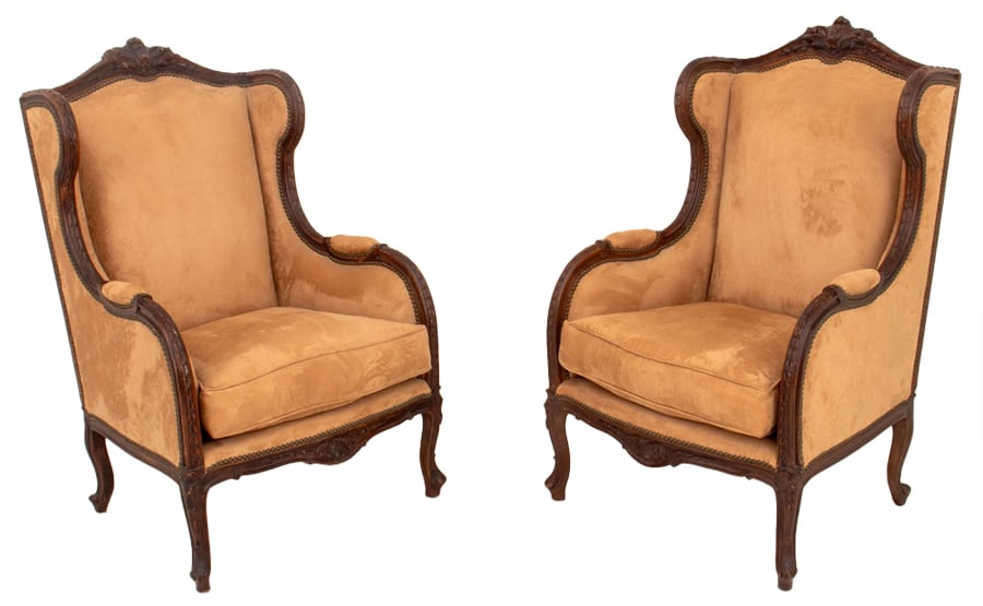 Louis XV Style Velvet Upholstered Bergeres, Pair: Pair of Louis XV Style Walnut Bergeres, with riveted trim, and beige velvet upholstery on fluted cabriole legs. 47.5" H x 28" W x 24.5" D; seat: 19.5" H. Provenance: From a Ft. Lee Collection. Keyword