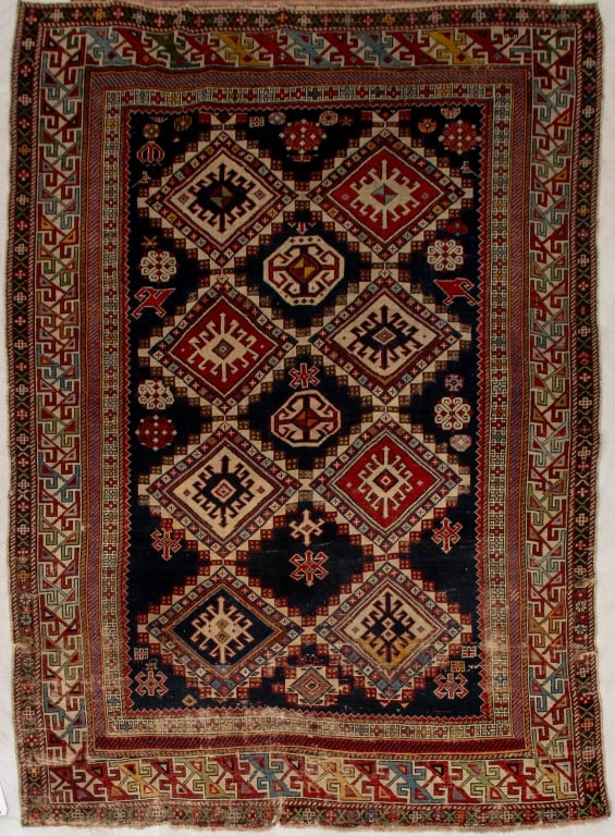 Caucasian Kazak Rug, 6' 9" x 5': Caucasian Kazak Rug, navy ground with diamond center medallions, geometric border. 6' 9" L x 5' W. Provenance: From a 57th Street Estate. Keywords: Carpets, Area rug, Textiles, Vintage, Polychrome, Wo
