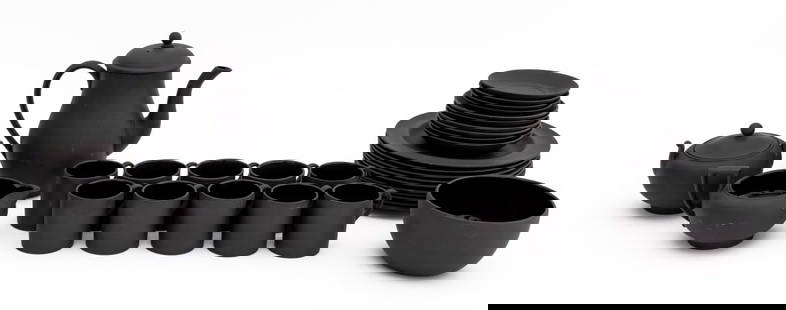 Wedgwood Black Basalt Cafe Noir Service for 10: Wedgwood Black Basalt Cafe Noir Partial Service for Ten, most marked "Wedgwood / Made in England" to underside, and comprising: ten (10) cups, four (4) small saucers, six (6) larger dishes, ten (10) d