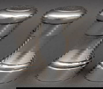 Tiffany & Co. Makers Sterling Silver Shaker Set, 2: Tiffany and Company Makers Sterling Silver Salt Shaker Set, each marked "Tiffany & Co. / makers / Sterling / 23977" to underside. Weight: 7.28 ozt.; 3.5" H x 2" Diameter. Provenance: From a 50 Central