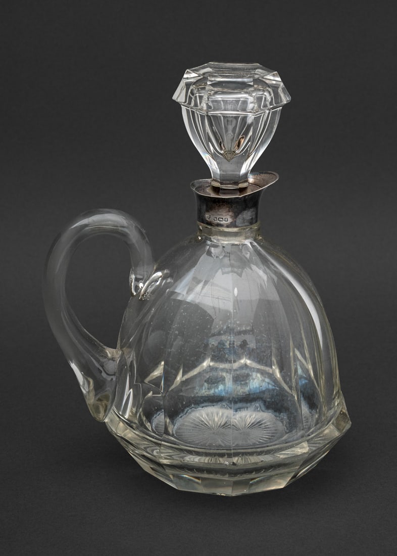 Edwardian Silver Mounted Cut Glass Claret Jug: Edwardian Sterling Silver Mounted Cut Glass Claret Jug, struck with marks for Maxfield and Sons, Sheffield, 1910. 8.5" H x 6.25" W x 5" D. Provenance: From a New York City Collection. Keywords: Antiqu