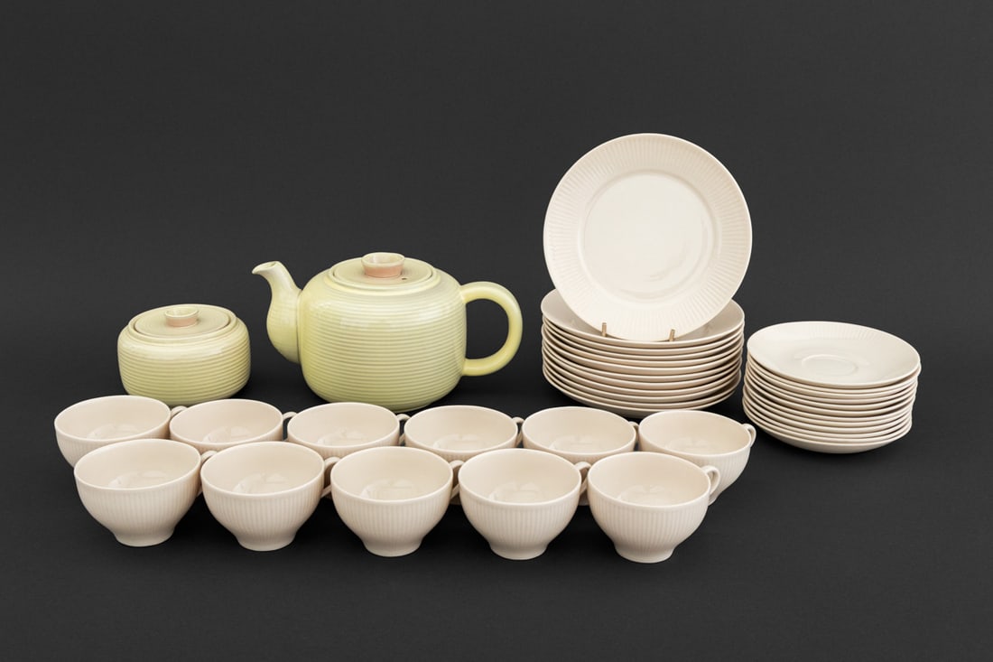 Arabia Ceramic Harlequin Tea Service, 37 Pcs.: Arabia Ceramic Harlequin Tea and Coffee Service, each marked "Arabia / Made in Finland" and comprising: (1) Michael Schilkin teapot and (1) covered sugar, (11) tea cups, (12) saucers, and (12) dessert
